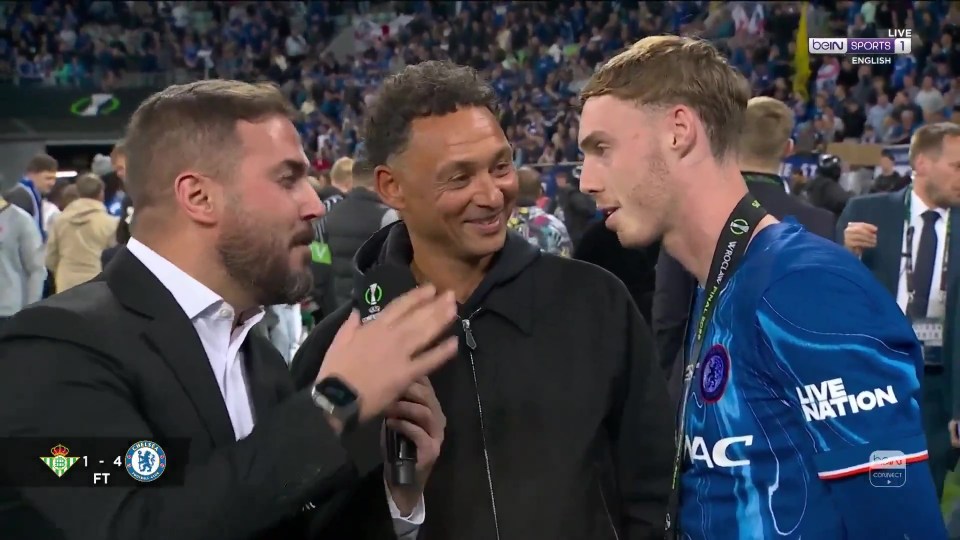 Cole Palmer and his father being interviewed after a soccer game.