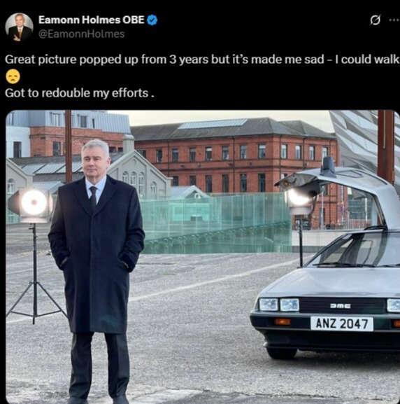 Screenshot of a tweet showing Eamonn Holmes standing next to a DeLorean.