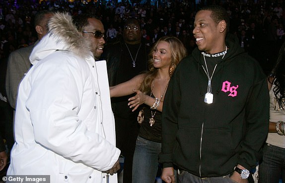 DENVER - FEBRUARY 20:  Sean 'P Diddy' Combs talks with Beyonce Knowles and Jay Z after  the 2005 NBA All Star Game at the Pepsi Center on February 20, 2005 in Denver, Colorado.   (Photo by Mark Mainz/Getty Images)
