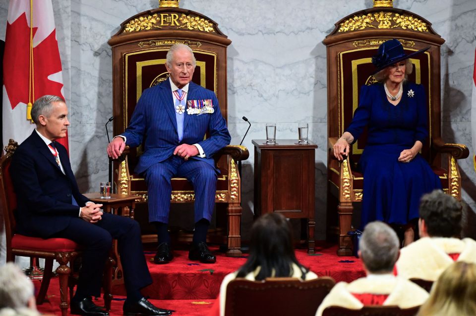 King Charles III and Queen Camilla seated on thrones at the opening of the Canadian Parliament, with Prime Minister Mark Carney seated to the side.