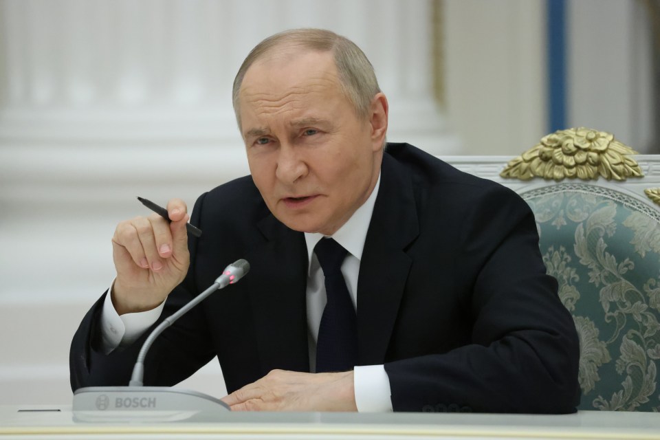 Vladimir Putin speaking at a meeting.
