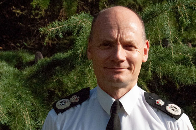 Headshot of Alex Murray in a police uniform.