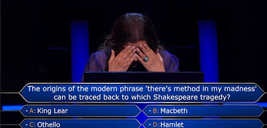 Screenshot of a game show contestant covering her face with her hands, with a question about Shakespeare on the screen.