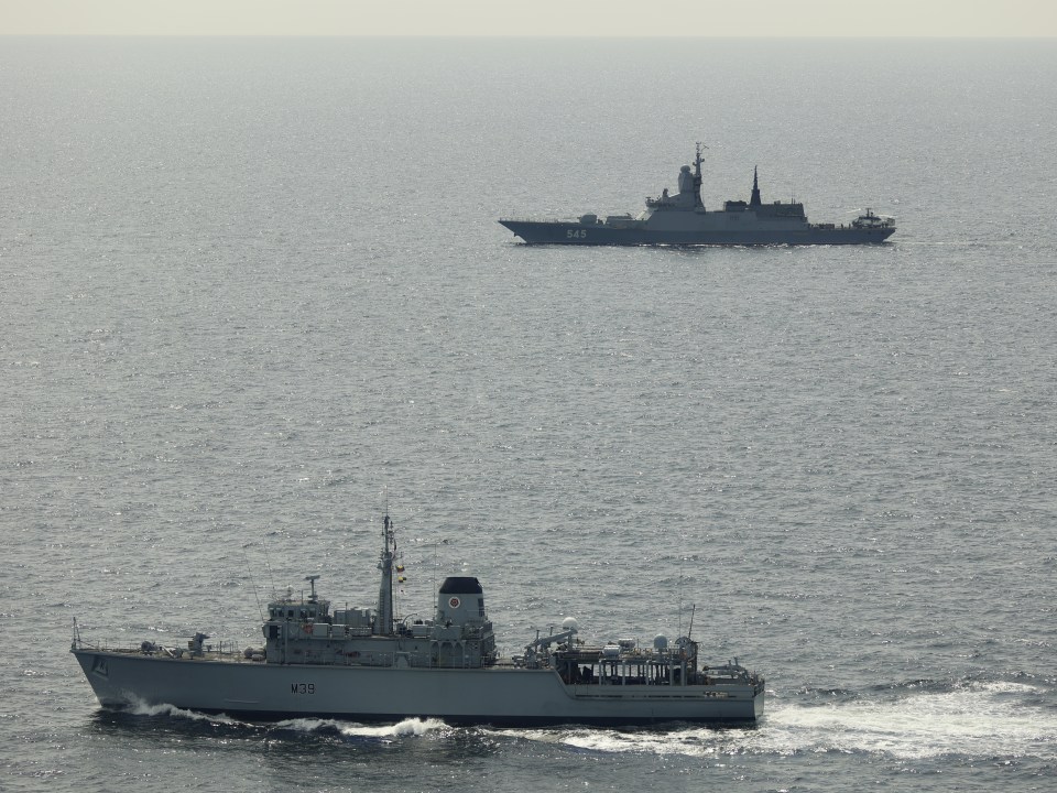 Royal Navy ships monitoring Russian vessels at sea.