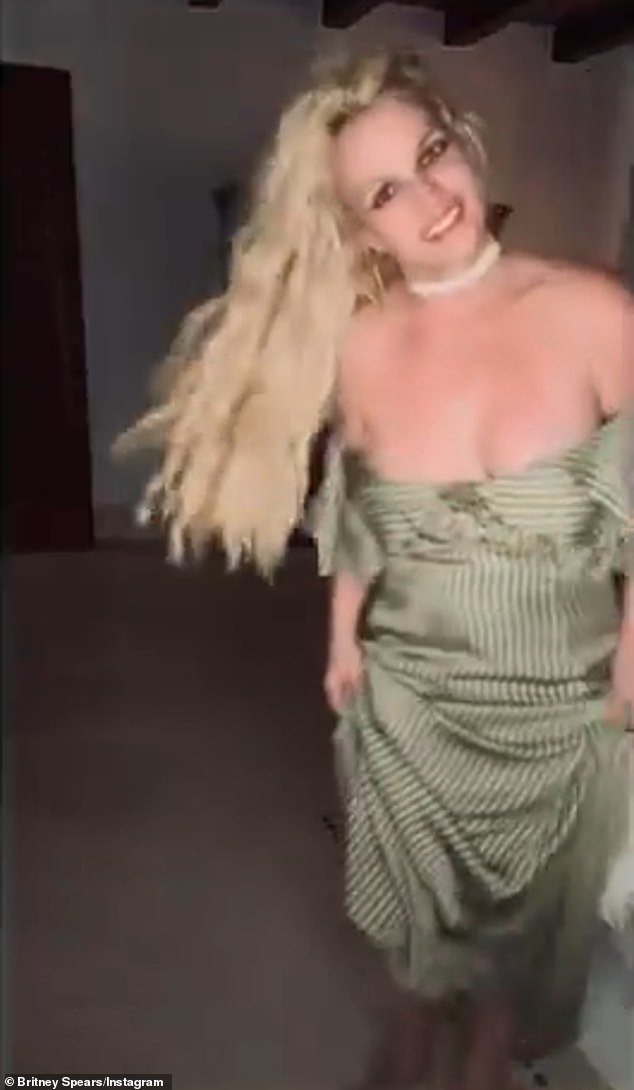 The performer swiftly noticed the malfunction and pulled the dress back up to properly cover her chest while keeping a smile on her face
