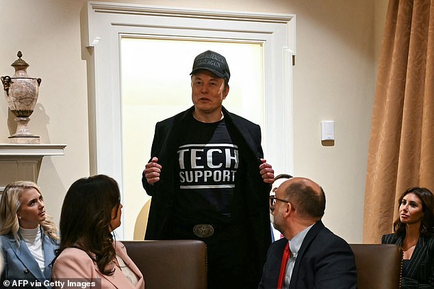 Leader of the Department of Government Efficiency Elon Musk wears a shirt that says "Tech Support" as he speaks during a cabinet meeting