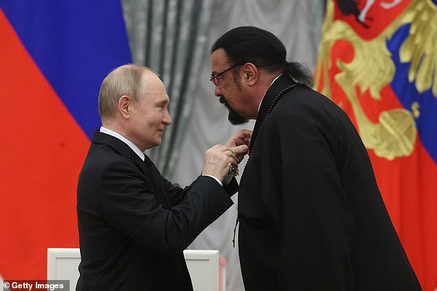 Putin giving the Order of Friendship to Seagal during an awards ceremony at the Kremlin in May 2024