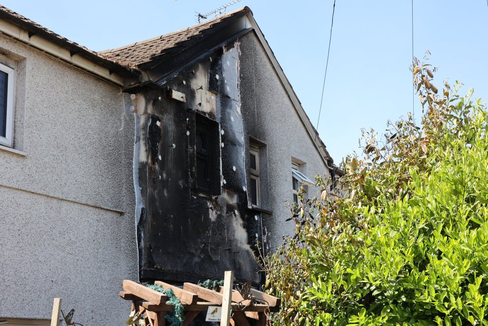 Fire-damaged side of a house.