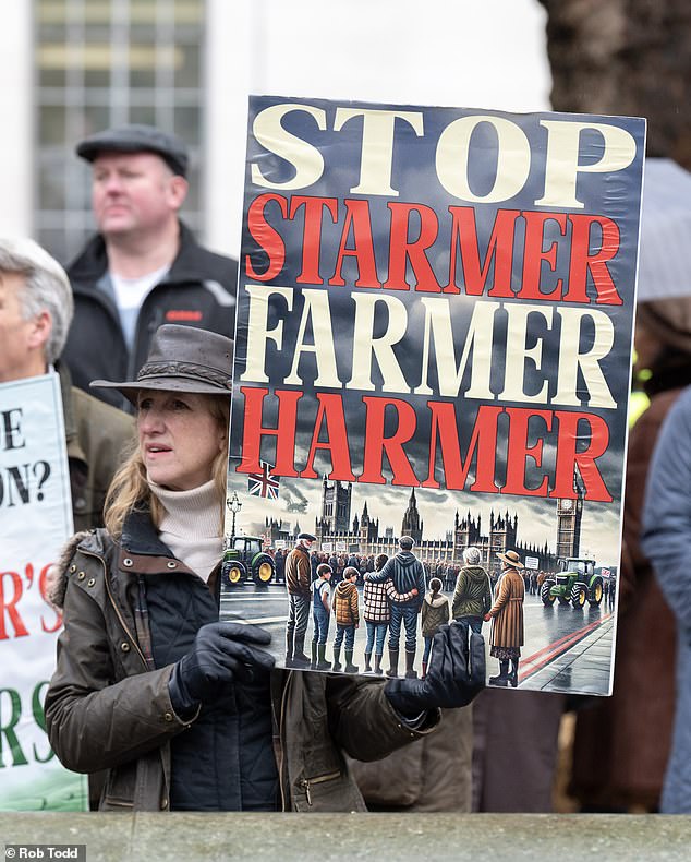 Farmers held placards denouncing the government for the impact of tax changes on the sector