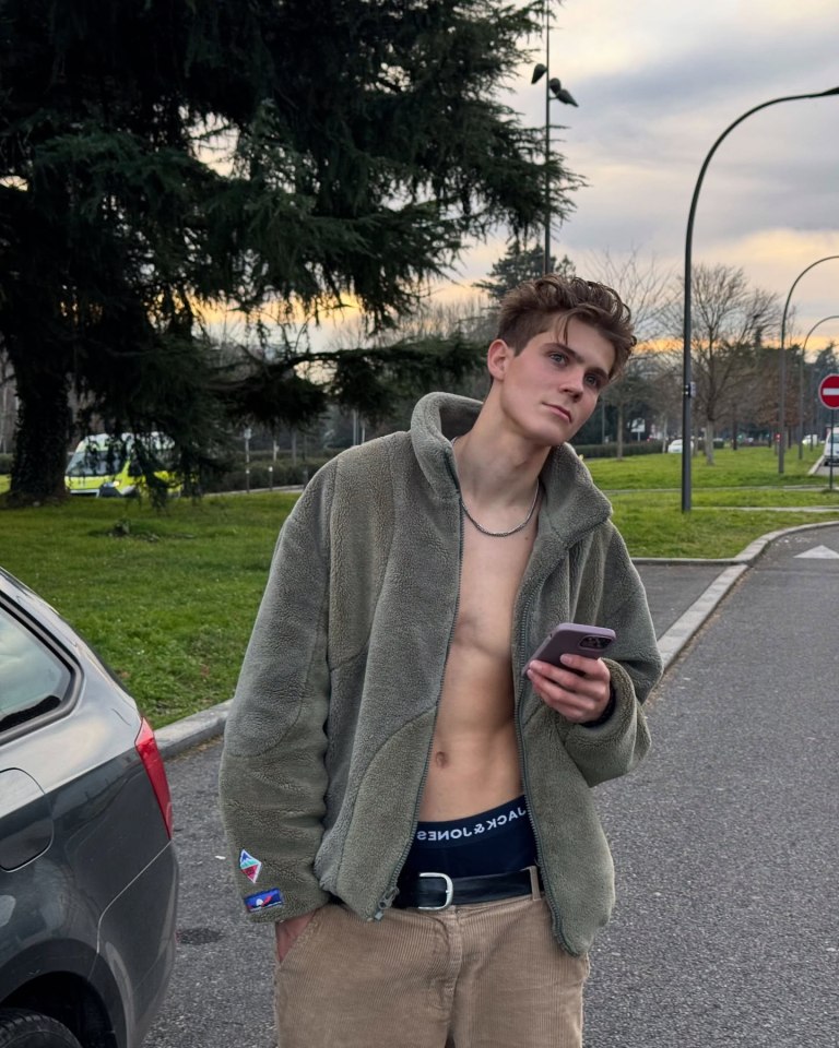 Young man using a smartphone outdoors.
