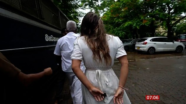 Charlotte was filmed in a white dress with her hands behind her back being escorted to a prison van by police outside the court building in the Sri Lankan capital.