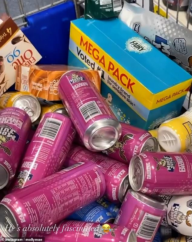 Stocking up: The video shared to Molly-Mae's Instagram saw the couple head to Home Bargains/B&M where she filmed their trolley filled up with bargain energy drinks and other household goods