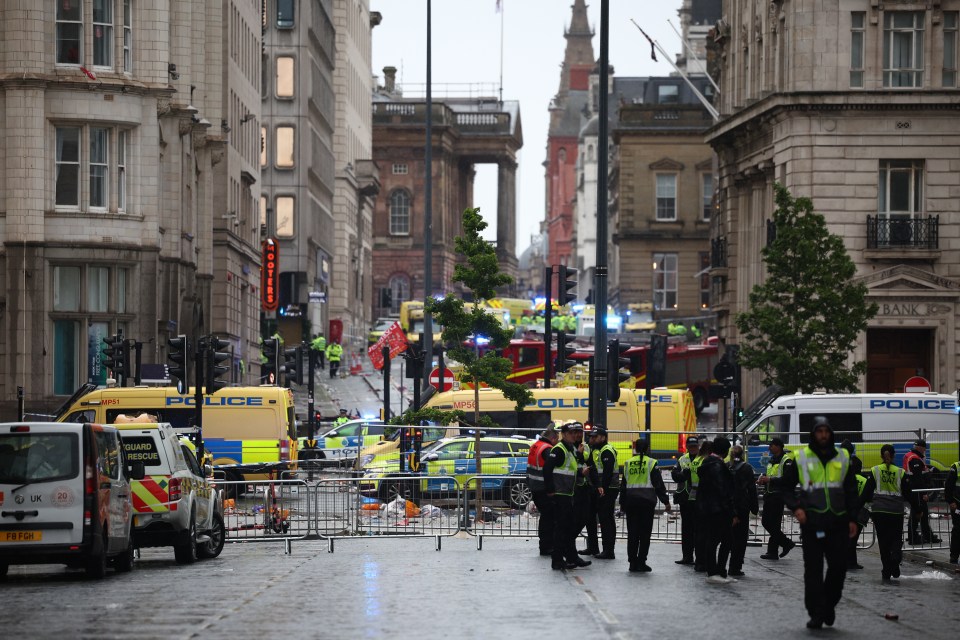 Aftermath of a car collision with pedestrians during a Liverpool FC victory parade.