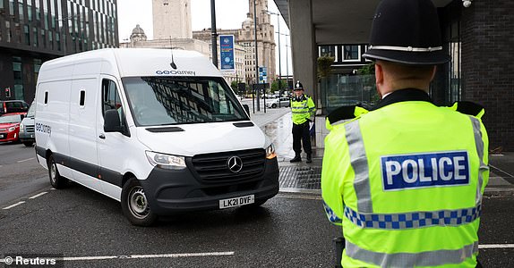 A prison van believed to be transporting Paul Doyle, the 53-year old charged with multiple offences including dangerous driving and causing grievous bodily harm after a car drove into a crowd at Liverpool FC's trophy parade, arrives at Liverpool Magistrates' Court in Liverpool, Britain, May 30, 2025. REUTERS/Phil Noble