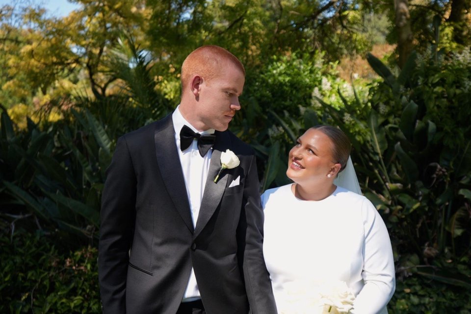 A plus-size bride and groom on their wedding day.