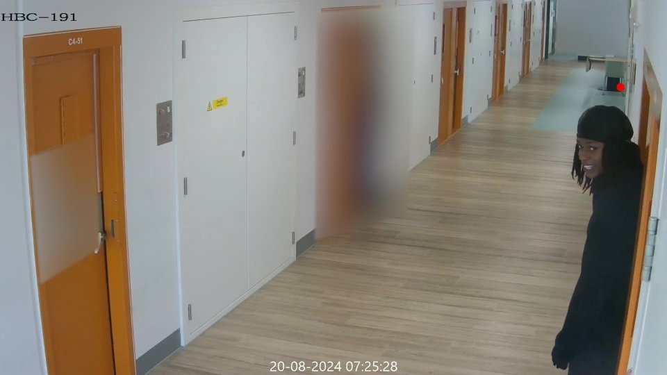 CCTV image of a smirking man leaving a prison cell after a murder.