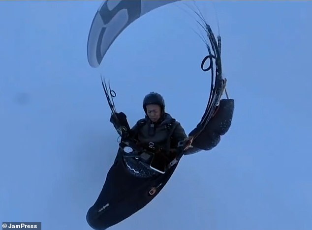 The man miraculously remained conscious throughout the ordeal and managed to successfully land his parachute safely