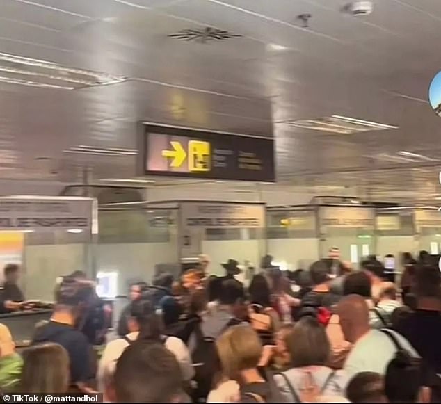 Officials called an emergency meeting after passengers raged at the 'inhumane' conditions that saw them packed together 'like cattle' as they waited in line on Monday