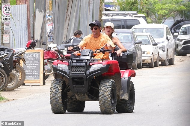 The couple had a playful chat outside of a restaurant before jumping on a quad bike and heading off to explore