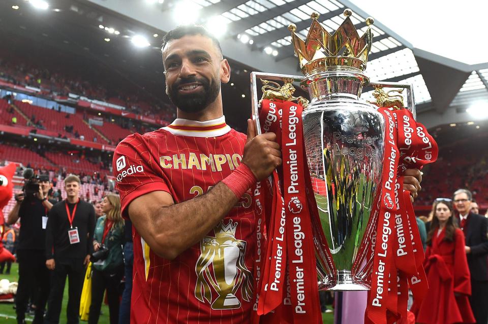 Mohamed Salah holding the Premier League trophy.