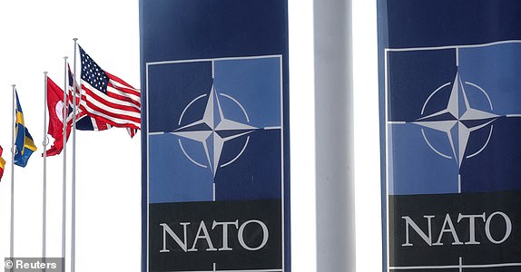 FILE PHOTO: National flags of Alliance's members flutter at NATO headquarters in Brussels, Belgium April 2, 2025. REUTERS/Yves Herman/File Photo