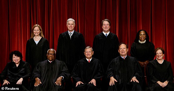 FILE PHOTO: U.S. Supreme Court justices pose for their group portrait at the Supreme Court in Washington, U.S., October 7, 2022. Seated (L-R): Justices Sonia Sotomayor, Clarence Thomas, Chief Justice John G. Roberts, Jr., Samuel A. Alito, Jr. and Elena Kagan. Standing (L-R): Justices Amy Coney Barrett, Neil M. Gorsuch, Brett M. Kavanaugh and Ketanji Brown Jackson. REUTERS/Evelyn Hockstein      TPX IMAGES OF THE DAY/File Photo