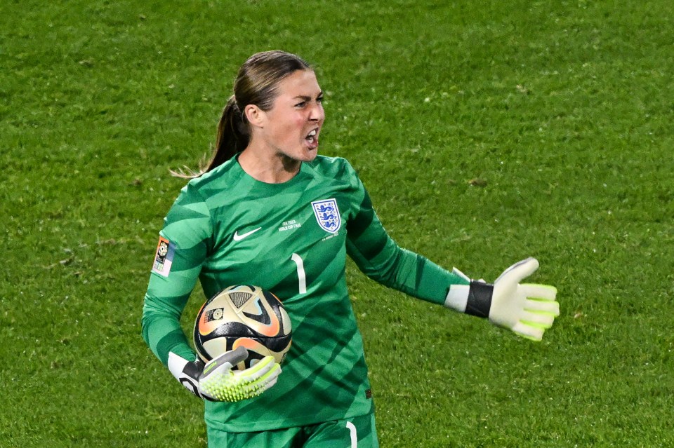 Mary Earps, England's goalkeeper, reacts after saving a penalty.