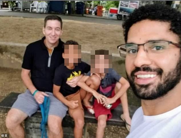 Greenwald is seen here alongside his late husband and their two children that they adopted