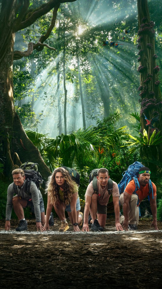 Four contestants at the starting line of a race in a jungle.
