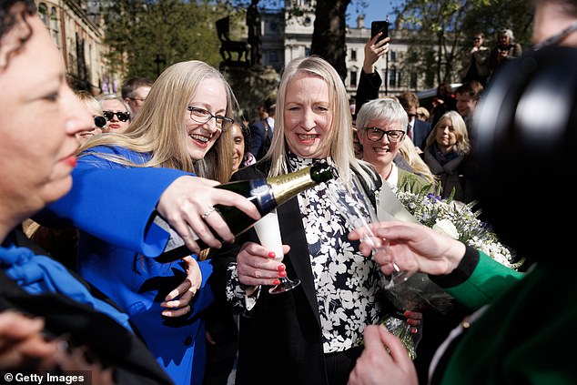 Marion Calder (centre), Helen Joyce (centre left) and Maya Forstater (left) celebrate outside the Supreme Court