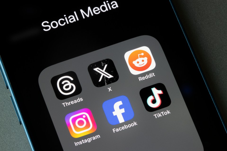 Portland, OR, USA - Oct 26, 2023: Assorted social media apps, including Threads, X, Reddit, Instagram, Facebook, and TikTok, are seen on an iPhone.