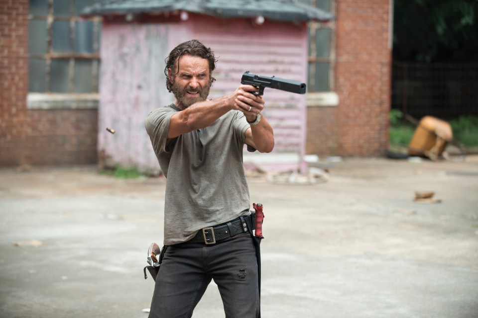 A man aiming a handgun.
