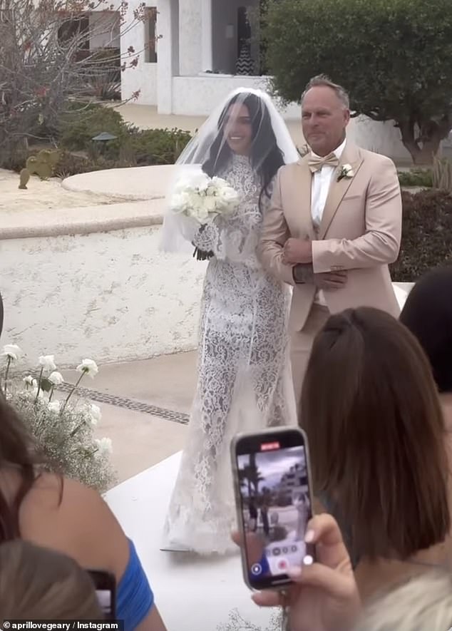 The bride — who has welcomed three children with Thicke — walked down the aisle in a stunning white lace gown