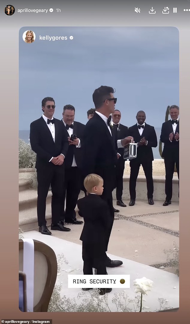 For Robin's strut to the altar, he suited up in a black tuxedo and held hands with the couple's two-year-old son Luca Patrick, who served as ring bearer