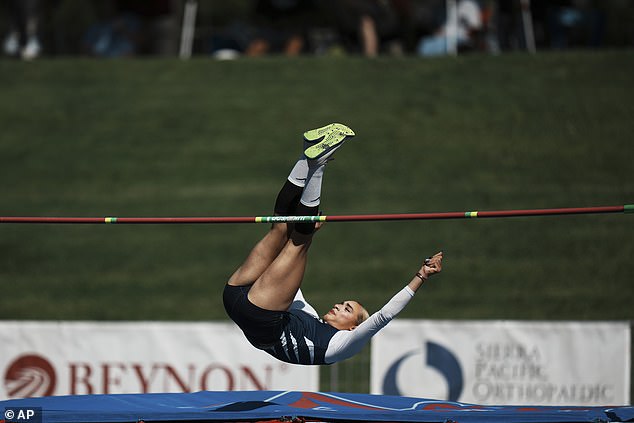 The transgender athlete is pictured competing in the high jump at Buchanan High School