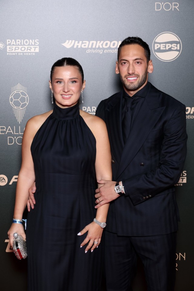 PARIS, FRANCE - OCTOBER 28: Hakan Calhanoglu (R) of Inter Milan and Turkey and Sinem Gundogdu attend the 68th Ballon D'Or Photocall at Theatre Du Chatelet on October 28, 2024 in Paris, France. (Photo by Pascal Le Segretain/Getty Images)