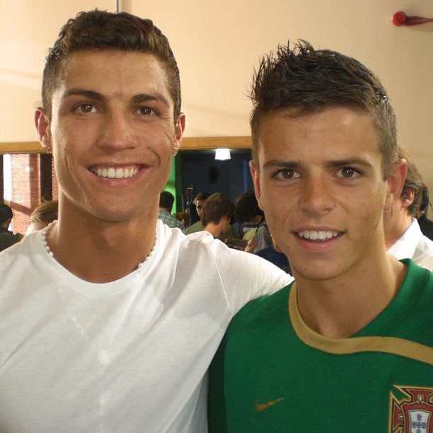 Cristiano Ronaldo with a young soccer player.