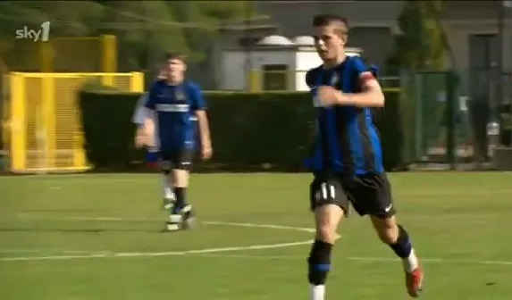 Soccer player running on a field.