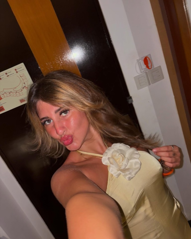 Selfie of a woman wearing a pale yellow dress.