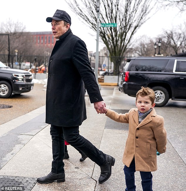 The world's richest man claimed he received his black eye from his five-year-old son X, saying they were 'horsing around and I told him to punch me in the face' (seen in February)