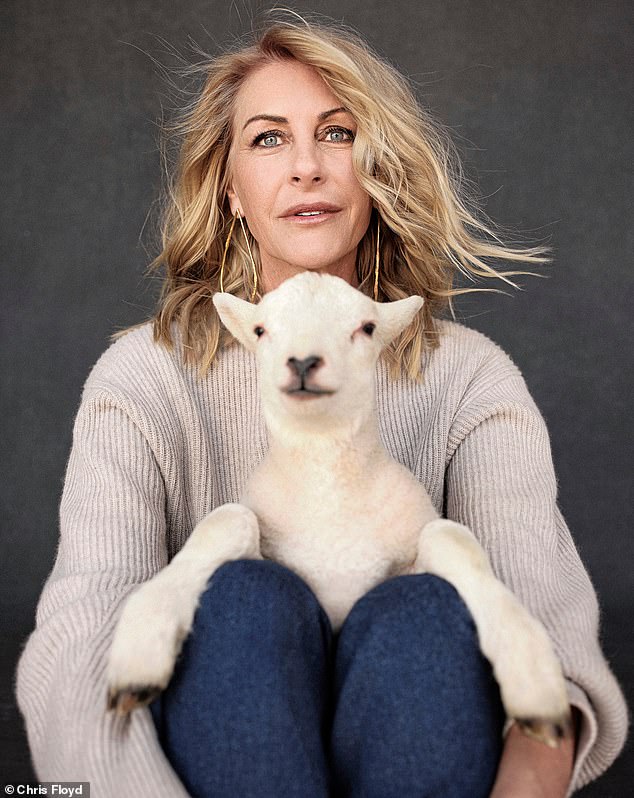 Jumper, Max Mara. Jeans, Palmer Harding. Earrings, Misho. Lamb, model’s own