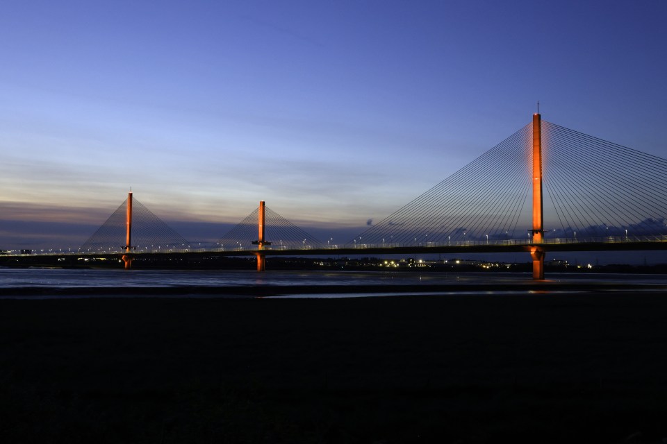 Mersey Gateway Bridge lit orange at night to raise awareness for Prader-Willi Syndrome.