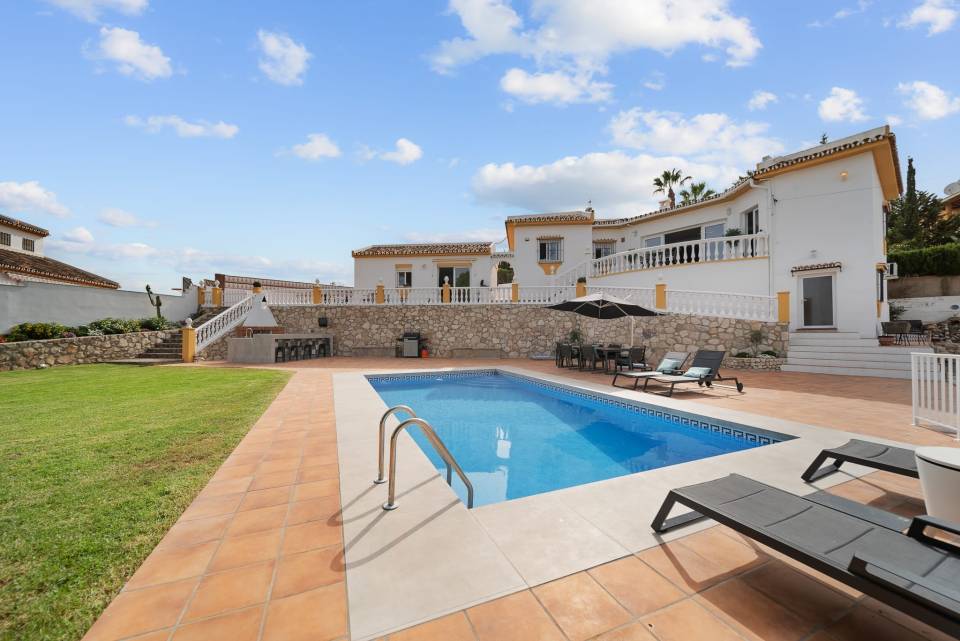Villa with pool and patio.