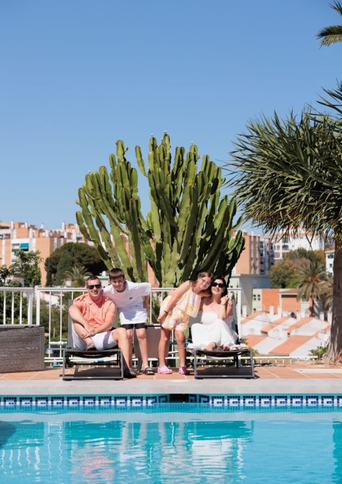 Family by a pool in Spain.