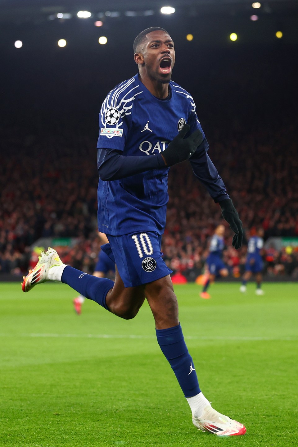 Ousmane Dembele of Paris Saint-Germain celebrating a goal during a UEFA Champions League match.