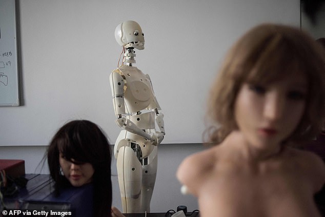This photo taken on February 1, 2018 shows robots in a lab of a doll factory of EXDOLL, a firm based in the northeastern Chinese port city of Dalian