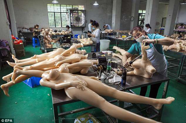 Pictured is a worker assembling a doll in dolls factory in Dongguan
