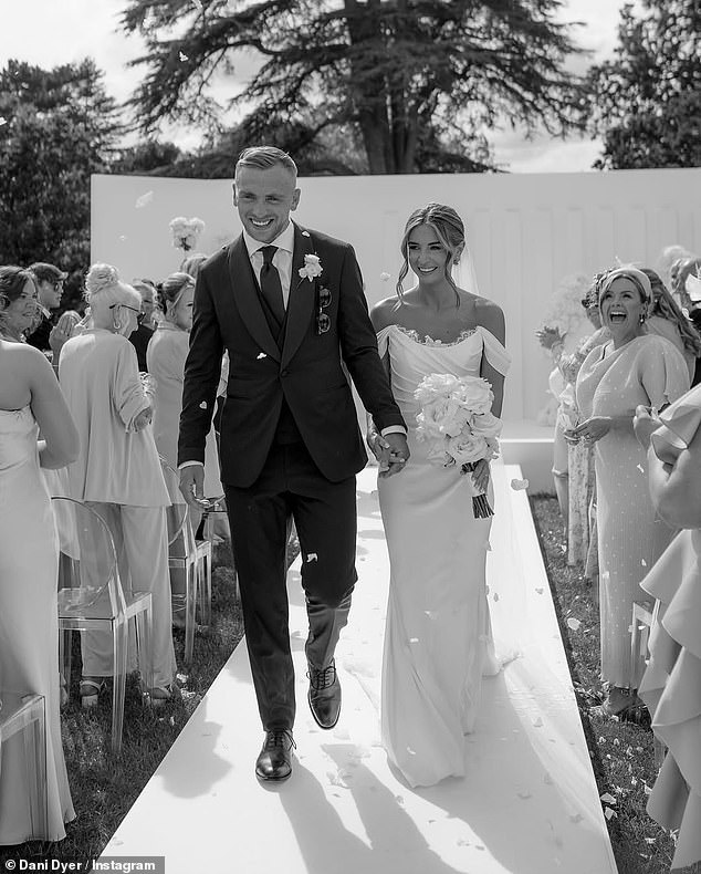 The TV personality, 28, stunned in an elegant off-the-shoulder gown to tie-the-knot with the West Ham captain, also 28
