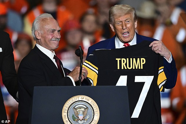 Mr Trump brought former Pittsburgh Steeler Rocky Bleier (left) onstage with current players, second-string quarterback Mason Rudolph and safety Miles Killebrew