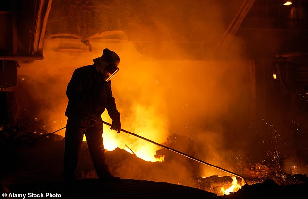 Pictured: A stock image of a steelworker using a lance on a blast furnace at at Port Talbot Steelworks in South Wales